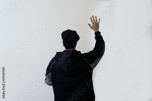 man showing fingers waiving hand sign gesture dark silhouette image photo