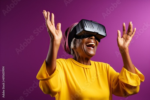 Immersed senior woman experiencing virtual reality with vr goggles on solid background
