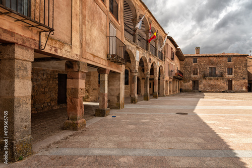 La Alhondiga, a small 16th century building with a double gallery facade with four arches in each one and a ducal shield, which was a building for the grain exchange, Medinaceli, Soria, Spain photo