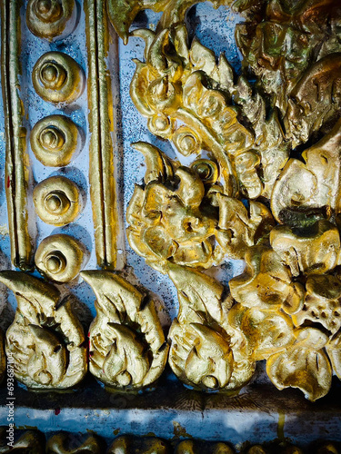  Thai style sculpture on the wall of temple in northern Thailand