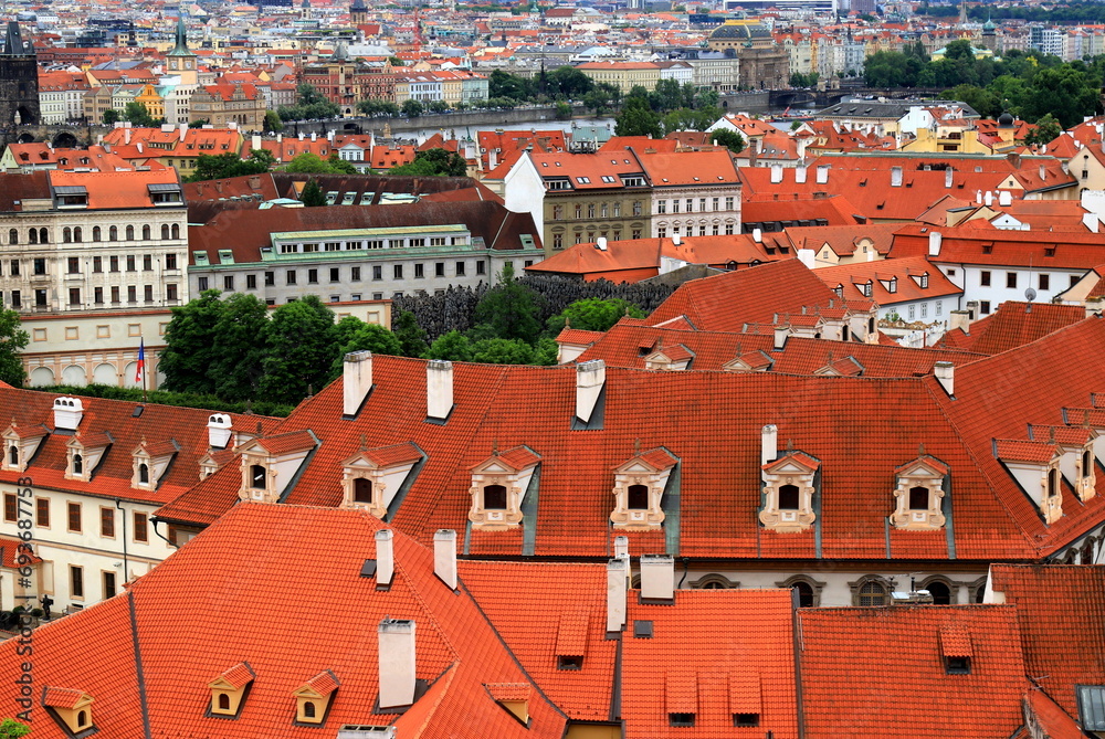Fototapeta premium Old medieval houses, building, red tiled roofs in Prague, Czech Republic, panorama. Historical buildings in Prague Czechia