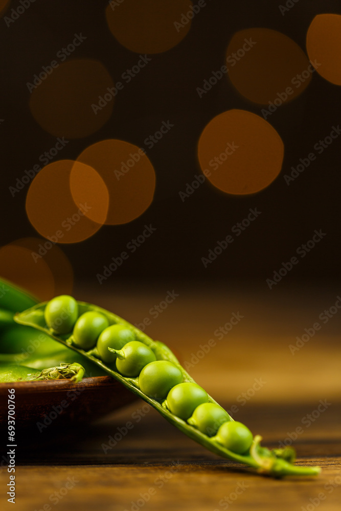 Green pea pods and beautiful background with golden blur