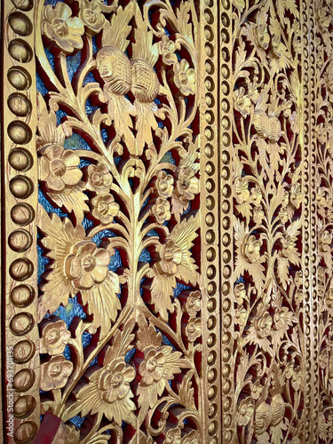 wood pattern - Thai style  sculpture on the wall of temple in northern Thailand