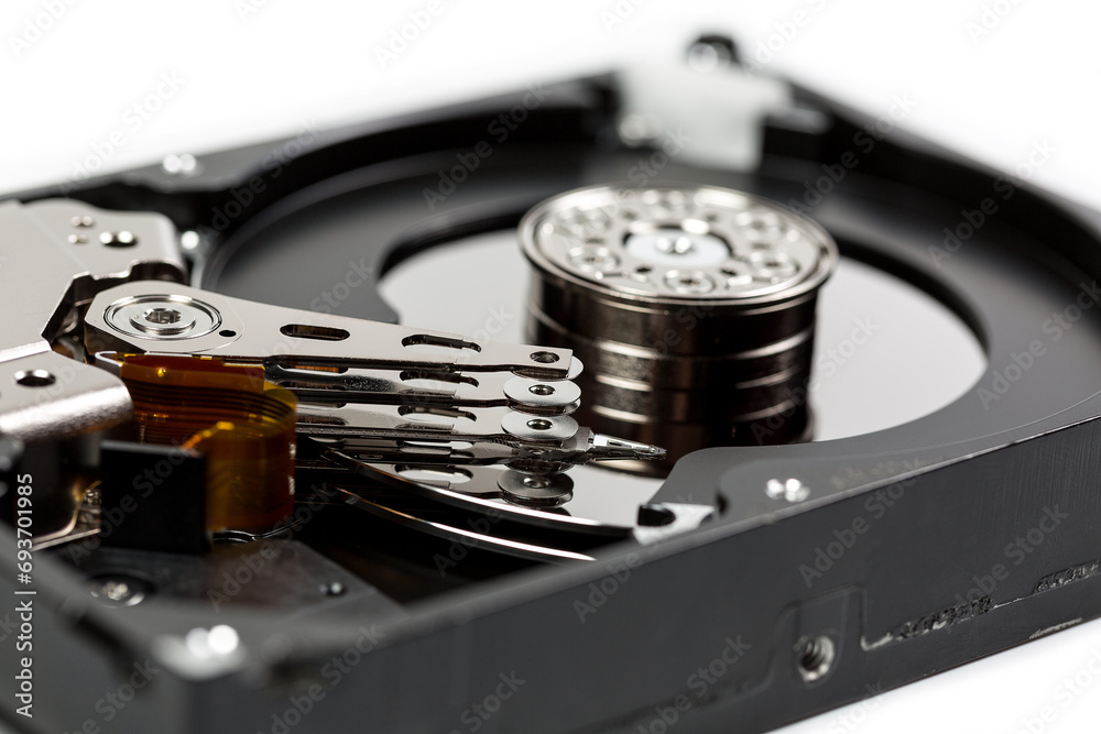 Disassembled hard drive on a white background, hard drive repair Disassembled hard drive on a white background, hard drive repair