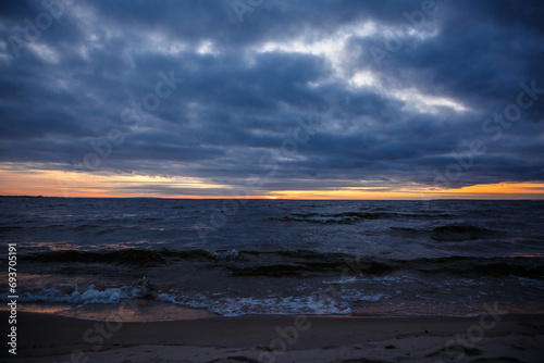 Cloudy sunset on the seashore, beautiful sunset by the sea