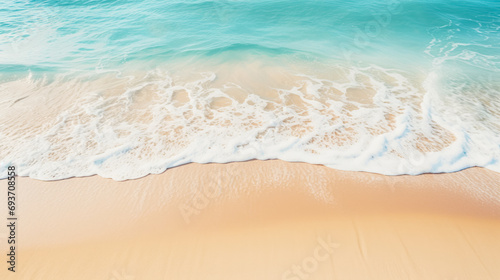 A high-angle view of a beach with crystal clear turquoise water  gentle waves  and golden sand.