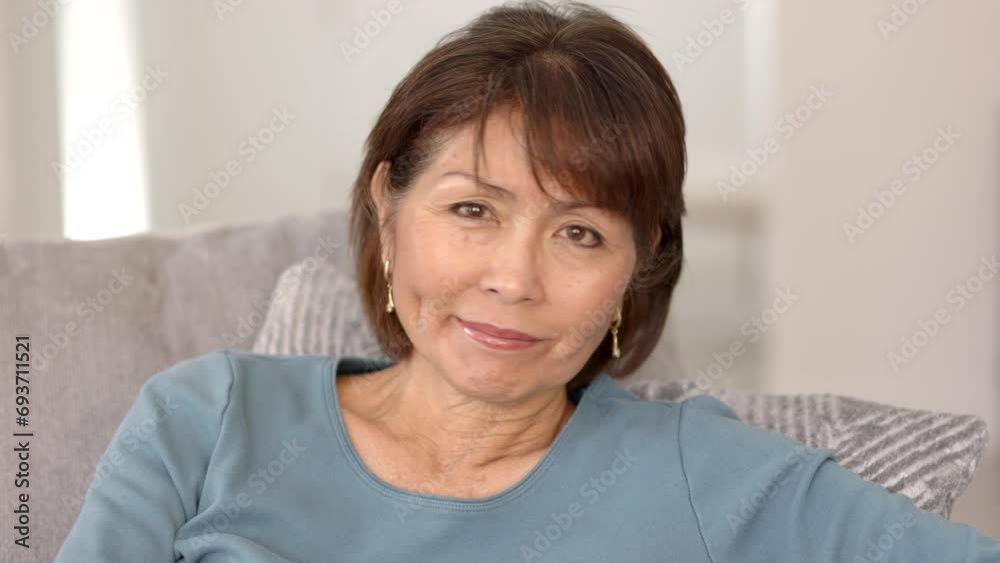 Happy beautiful slim woman smiling looking at camera enjoying making humorous faces smirking and winking Happy beautiful slim woman smiling looking at camera enjoying making humorous faces smirking and winking
