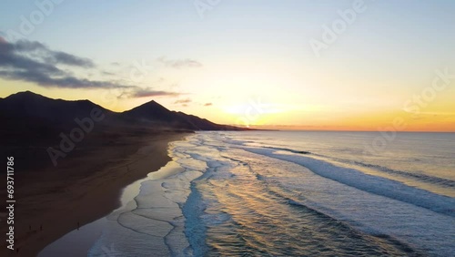 Aerial drone view of Cofete beach in Fuerteventura, Canary Islands, Spain. Beautiful sunset light. Travel destination. Wilderness.