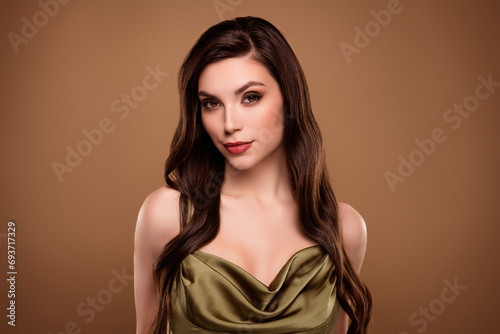 Photo of shiny feminine adorable lady wear silk dress smiling isolated brown color background