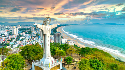 Aerial view of coastal Vung Tau city, Vietnam in the morning. The place where there is a statue of Christ on the mountain protects Vung Tau Peninsula's peace. photo