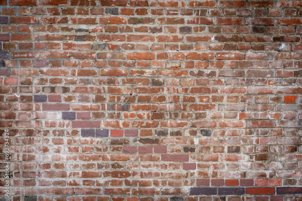 Old brick color stone wall There are natural stains. Close up. Old brick color stone wall There are natural stains. Close up.