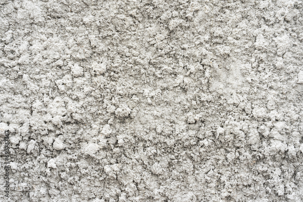 Background of an old wall with splashed cement pattern and white paint. Abstract wall texture backdrop Background of an old wall with splashed cement pattern and white paint. Abstract wall texture backdrop