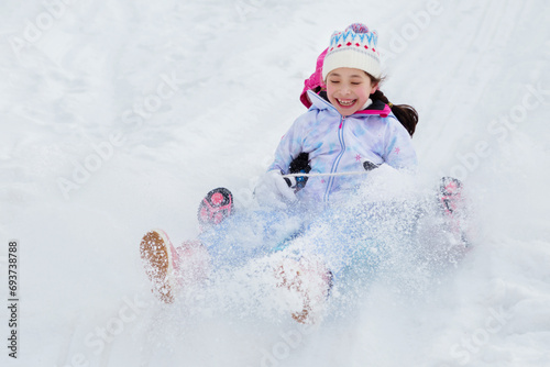 Winter entertainment on sledding. Time with friends.