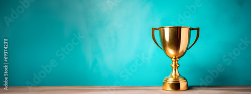 Golden trophy on turquoise background, winning theme with bright contrast. Victory concept. Generative AI photo