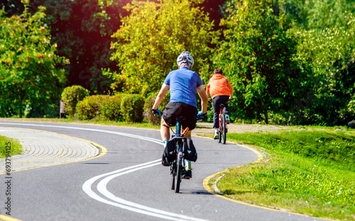 Wallpaper Mural Cyclist ride on the bike path in the city Park
 Torontodigital.ca