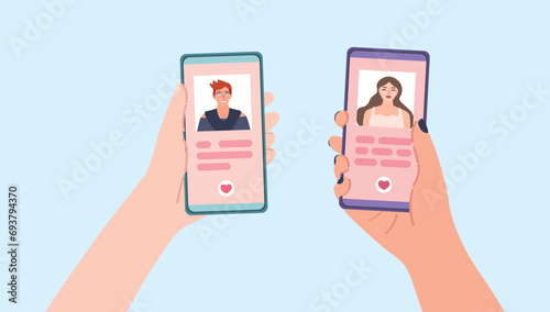 Hands holding mobile phones with open pages of online dating application on light blue background