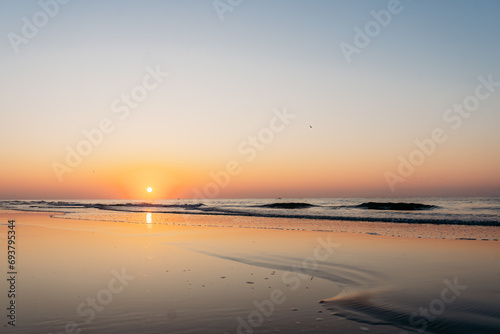 Sun rising over ocean at sunrise on Hilton Head Island Beach