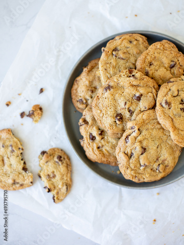 homemade chocolate chip cookies on white marble background