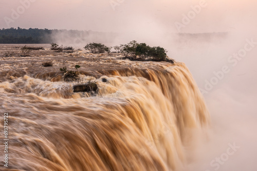 Beautiful view to strong waterfalls and rainforest in Iguazu Falls