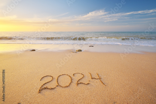 2024 year on the sea shore during sunset.