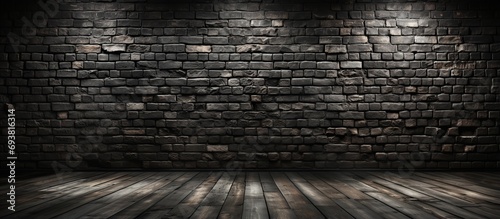 Black brick walls and wooden floors.