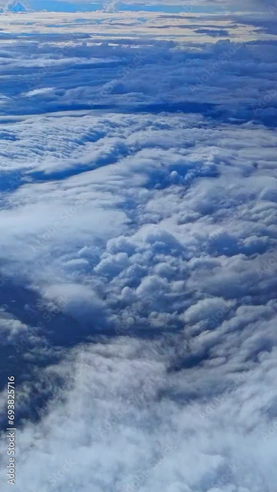 4k nature of clouds, View from an airplane window. Travel concept. traveler, trip, vacation, tourism, landscape. Aerial view sky