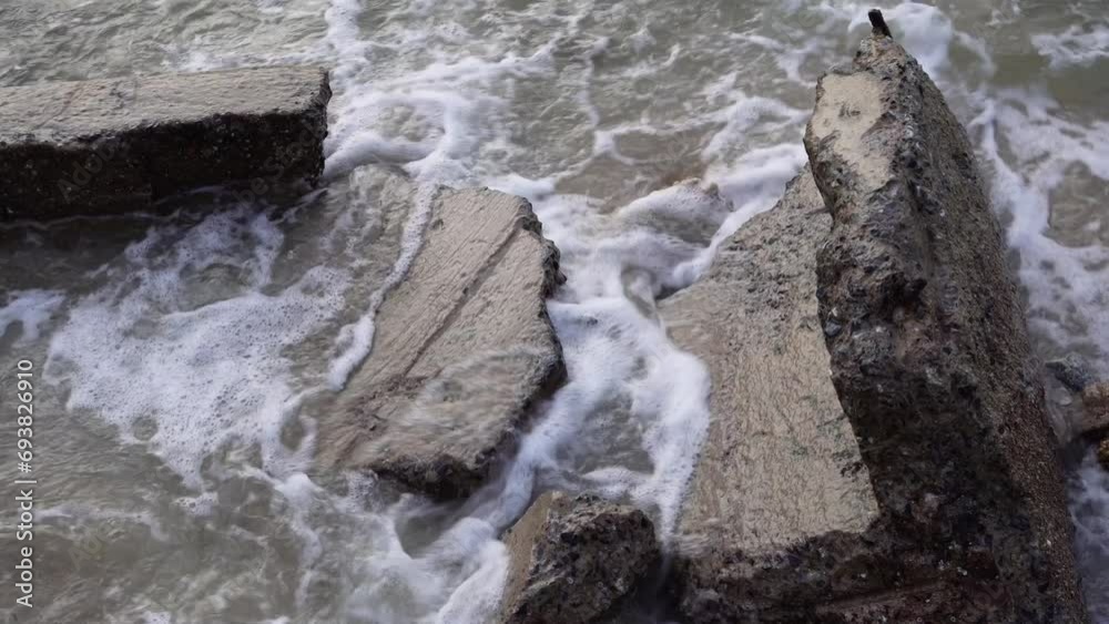 Ruined building debris scattered along the beach