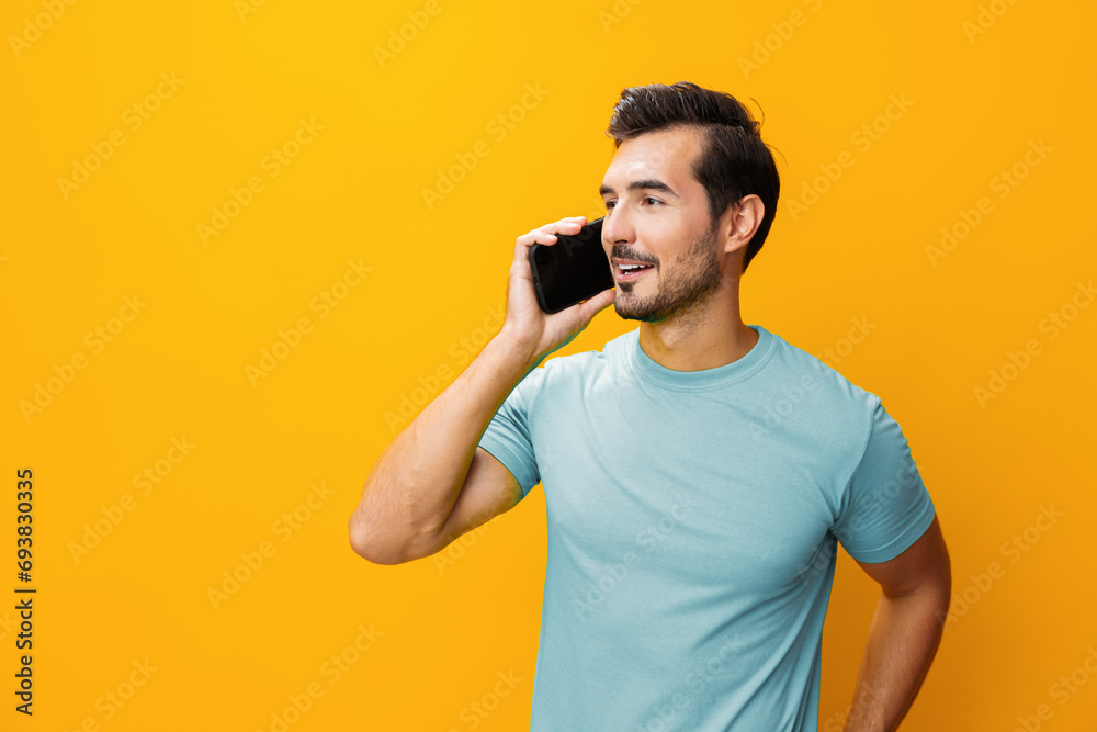 Portrait man message phone communication smartphone mobile technology yellow space cyberspace smiling phone studio happy copy Portrait man message phone communication smartphone mobile technology yellow space cyberspace smiling phone studio happy copy