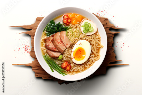 Ramen noodle soup with pork, egg and vegetables on wooden background. Top view photo