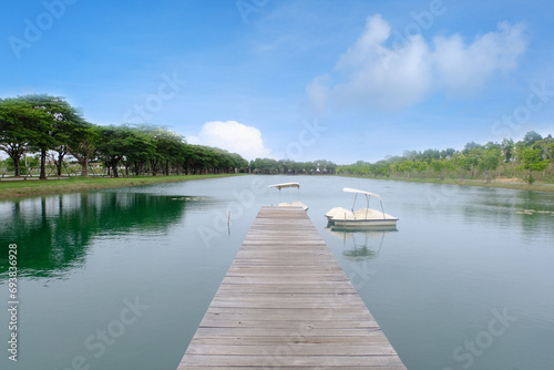 View of the pond and wooden bridge.