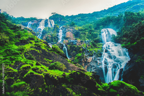 A breathtaking view of Dudhsagar Waterfall during the rainy season, a stunning display of cascading beauty.
