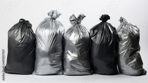 Black garbage bags stack or waste plastic bags isolated on white background, environment concept.
