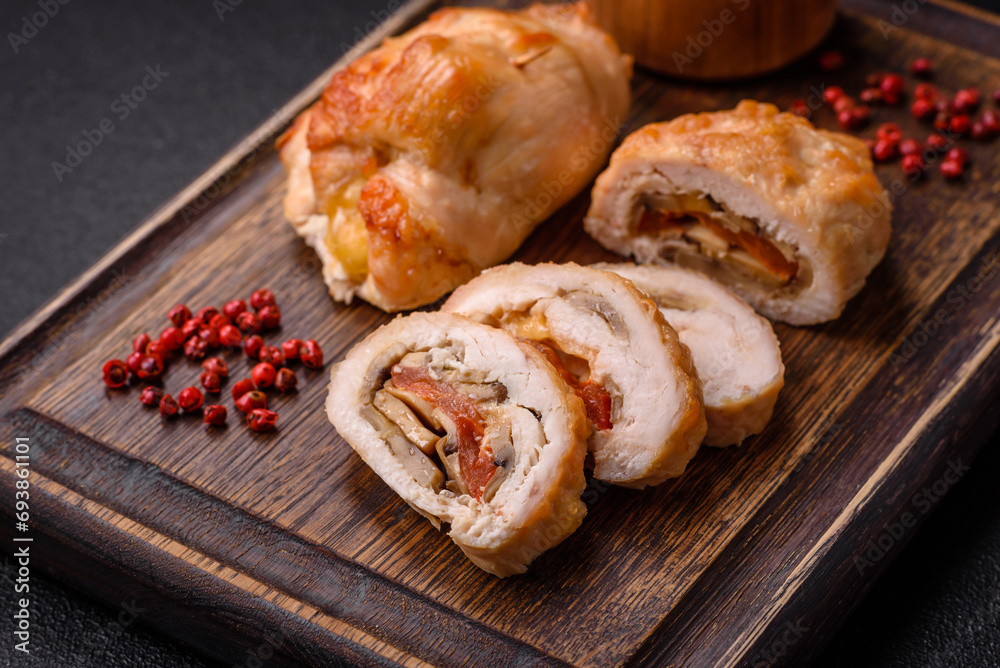 Delicious fresh meat roll made from chicken fillet, mushrooms, spices and herbs
