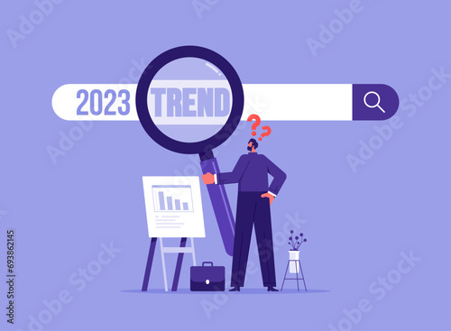2023 trend research or vision, new business opportunities or career challenges. Businessman uses magnifying glass for discovering website from search