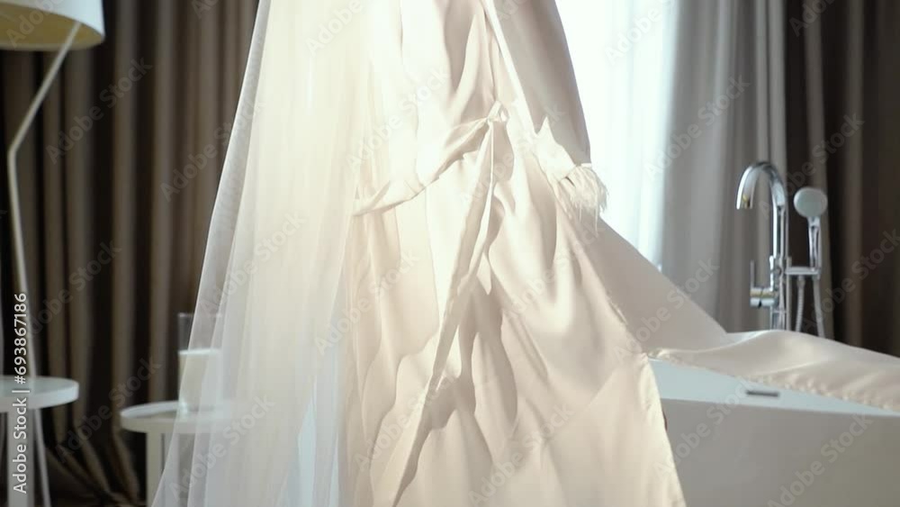 a beautiful sexy bride with a white veil in a peignoir in the morning goes to the bathroom getting ready for the wedding ceremony, a girl in a beautiful white dress a beautiful sexy bride with a white veil in a peignoir in the morning goes to the bathroom getting ready for the wedding ceremony, a girl in a beautiful white dress