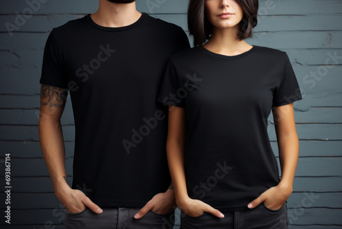 Mockup image of a man and woman couple wearing black T-shirts, looking cool in casual T-shirts in the city. Concept for fashion and trends.