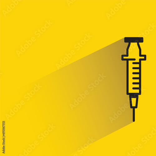 syringe icon with shadow on yellow background