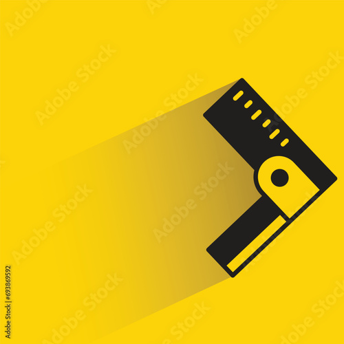 square ruler with shadow on yellow background