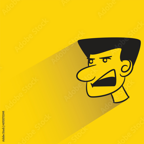 angry face with shadow on yellow background