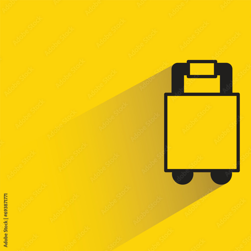 travel bag with shadow on yellow background