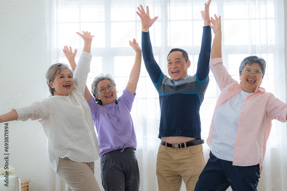 Group of Senior Retirement Friends Happiness Concept. Elderly people put hands together and cheer up. Seniors are moving their body arms and shoulders. retired people activities group concept. Group of Senior Retirement Friends Happiness Concept. Elderly people put hands together and cheer up. Seniors are moving their body arms and shoulders. retired people activities group concept.