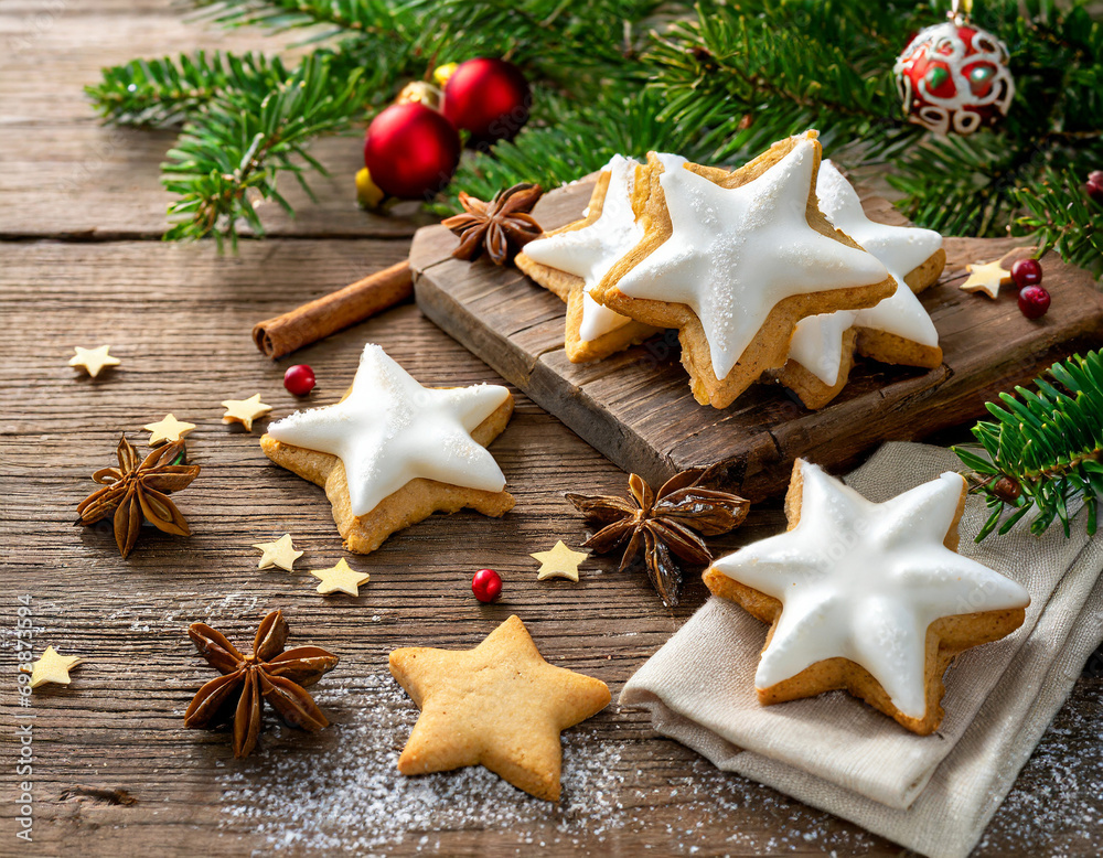 Christmas background with shortcrust star shaped cookies with white icing, star anise and glass ornaments on wooden table. Generate Ai Christmas background with shortcrust star shaped cookies with white icing, star anise and glass ornaments on wooden table. Generate Ai