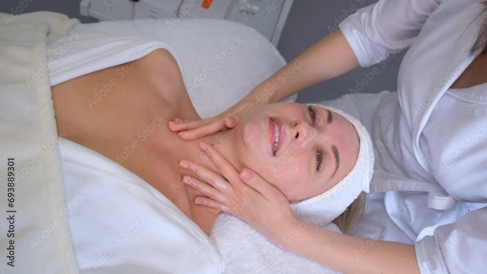 A woman is resting, enjoying a health therapy. Health and beauty. Young woman skin care. Doctor's hand. A woman is resting, enjoying a health therapy. Health and beauty. Young woman skin care. Doctor's hand.