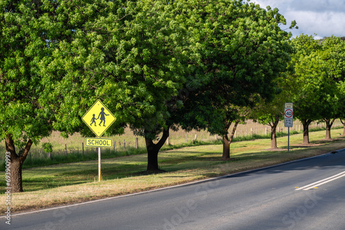 School zone road sign on a day in rural area of Victoria, Australia photo