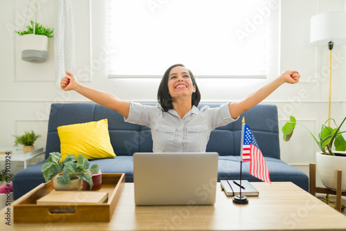 Happy woman excited about studying English online in the US photo
