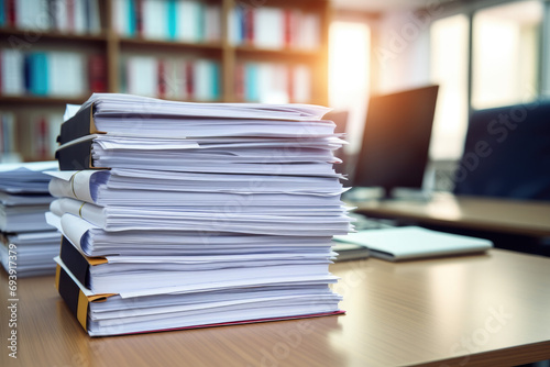 stack of business papers on the desk