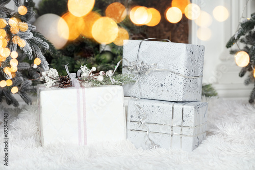 three Christmas gift boxes beautifuly wrapped photo