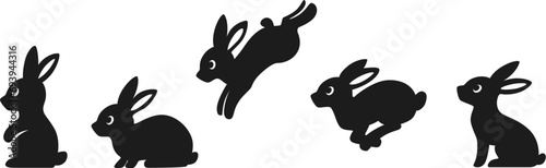 Set of sitting and jumping silhouettes of rabbits. Cute black bunnies.