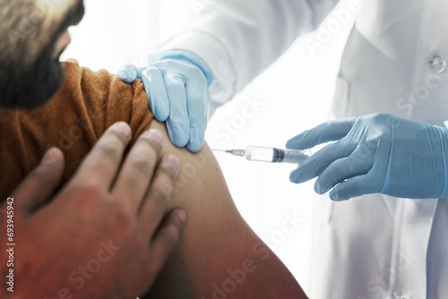 man being vaccinating by doctor close up