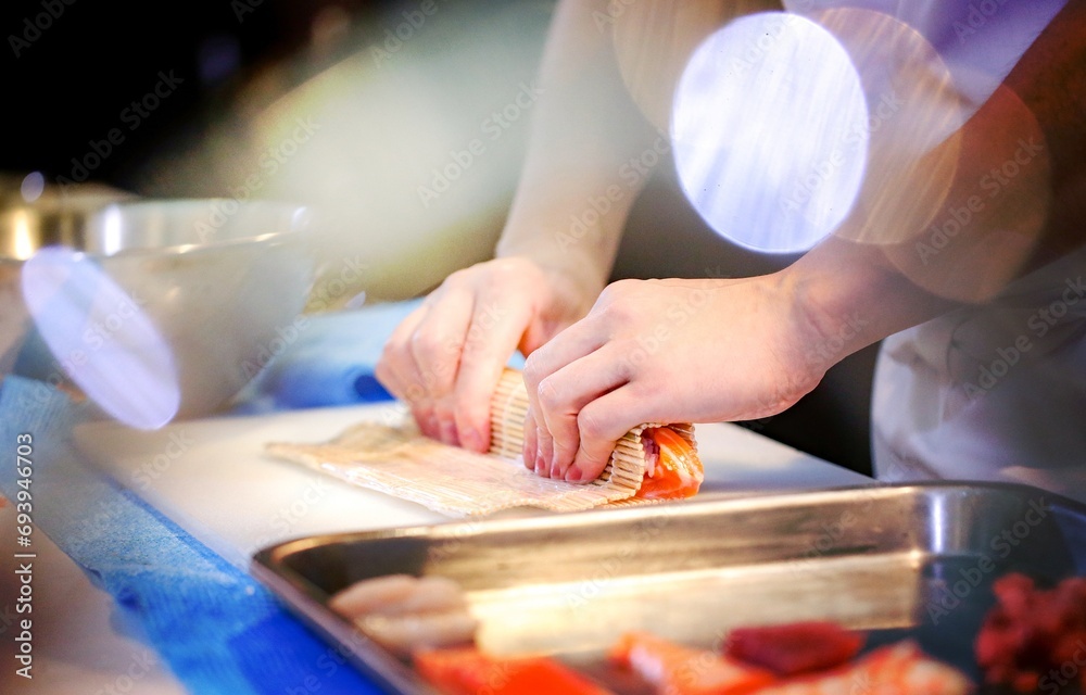 chef hands preparing japanese food, chef making sushi, Preparing Maki Sushi roll